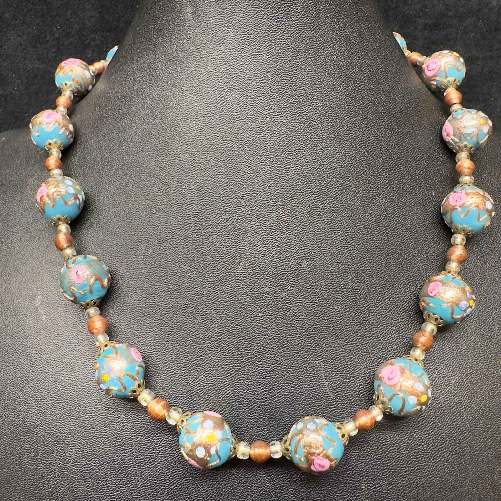 Venetian Murano Art Glass Lamp Work Floral Blue Copper Accent Bead Round Beaded Necklace E9: Venetian Murano Art Glass Lamp Work Floral Blue Copper Accent Bead Round Beaded Necklace E9. Necklace with blue colored glass beads with beautiful hand painted designs on each. The necklace features c