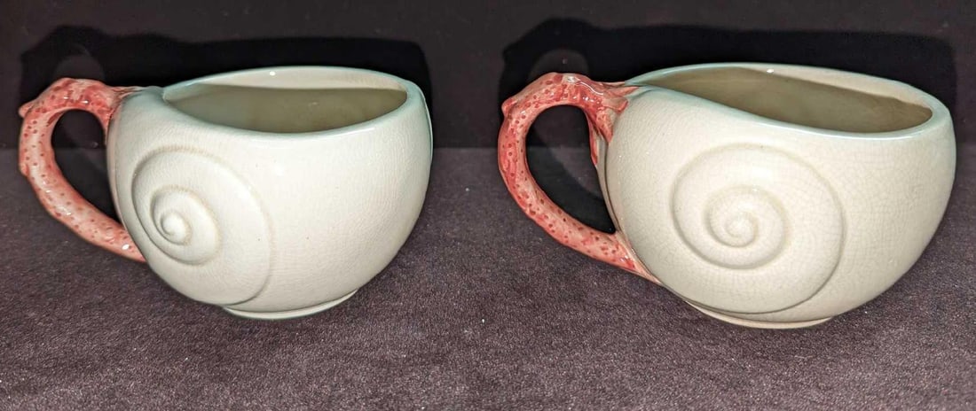 2 Vintage Retired Fitz & Floyd Oceana Flat Cups E K57: 2 Vintage Retired Fitz & Floyd Oceana Flat Cups E K57. This retired series was originally released in 1977. Each cup is approximately 5" x 4" x 2 1/2" and the total weight is 0.80lb. The cups have no