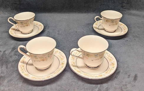 4 Retired Noritake Blossom Time Footed Cup & Saucers A: 4 Retired Noritake Blossom Time Footed Cup & Saucers A. The "Blossom Time" design was released from the year 1972 to the year 1985. Made of Ivory China. This lot includes: (4) Footed Cup.
