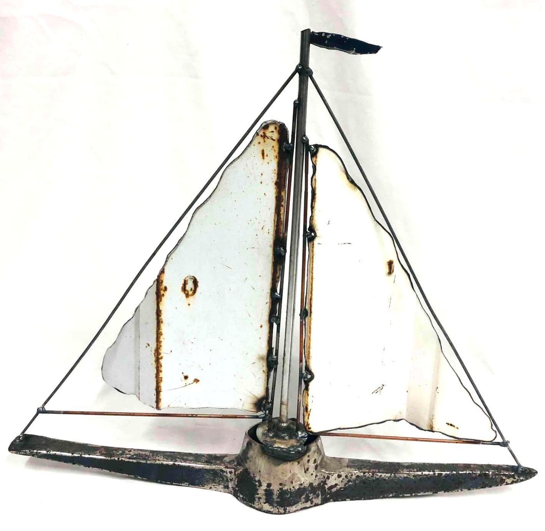 Large Metal Art Sail Boat Sculpture: This lot contains Metal Art Sail Boat Sculpture. Made in China. Its is approx 20 3/4" x 3" x 17 3/4" and it weighs about 6.4lbs. Overall the Sculpture is in good used condition with some light wear fr