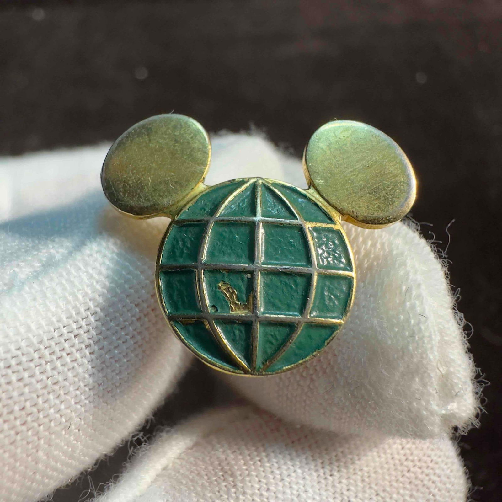 Disney Cast Member Green Mickey Head Globe Icon Original Service Award Pin: Disney Cast Member Green Mickey Head Globe Icon Original Service Award Pin. This is one of the original 1 year service pins given to a cast member on their first year anniversary with Disney. It has a