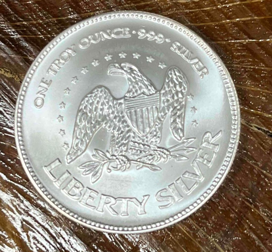 .999 Fine Silver A-Mark Liberty 1oz Bullion Round (C): This Round has been tested and researched to the best of our ability prior to listing. Please view photos, as they are a part of the condition. DETAILS: Metal - .999 Fine Silver Tested - Yes Size - 38