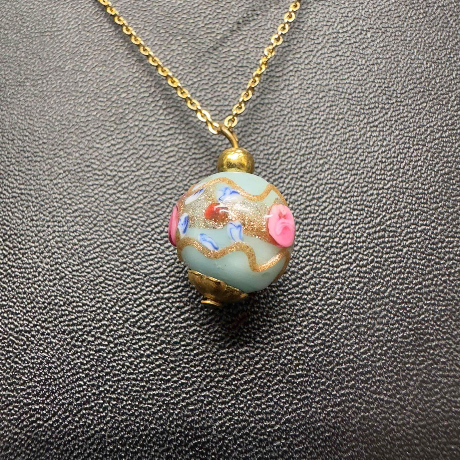 Venetian Murano Art Glass Lamp Work Gold Toned Chain Single Floral Light Blue Bead Necklace G98: Venetian Murano Art Glass Lamp Work Gold Toned Chain Single Floral Light Blue Bead Necklace G98. Necklace with light blue colored glass bead with beautiful hand painted design. The necklace features c