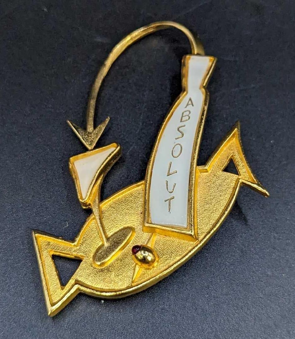 Absolut Vodka 1987 Billy Boy Brooch Pin Made In France: Absolut Vodka 1987 Billy Boy Brooch Pin Made In France. Rather rare promotional brooch that is approx 2" x 1/4" x 3 1/4" and it weighs 23.2 g. Has no chips or cracks. 