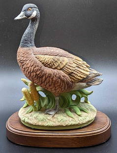 Vintage Porcelain Canadian Goose Figurine: Vintage Porcelain Canadian Goose Figurine. The date and maker of the figurine is unknown. Is marked "43-3242 RN-49964" on the bottom. The figurine is approx 6" x 4 1/2" x 8". The display stand is appr