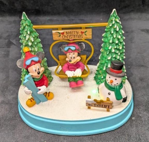 Disney Animated Ski Lift Lights & Music: Disney Animated Ski Lift Lights & Music. Plays four different holiday melodies. It comes in the original box that is approx 9 1/4" x 6 1/2" x 8" and it weighs 1.40lb. Was tested and both the lights an