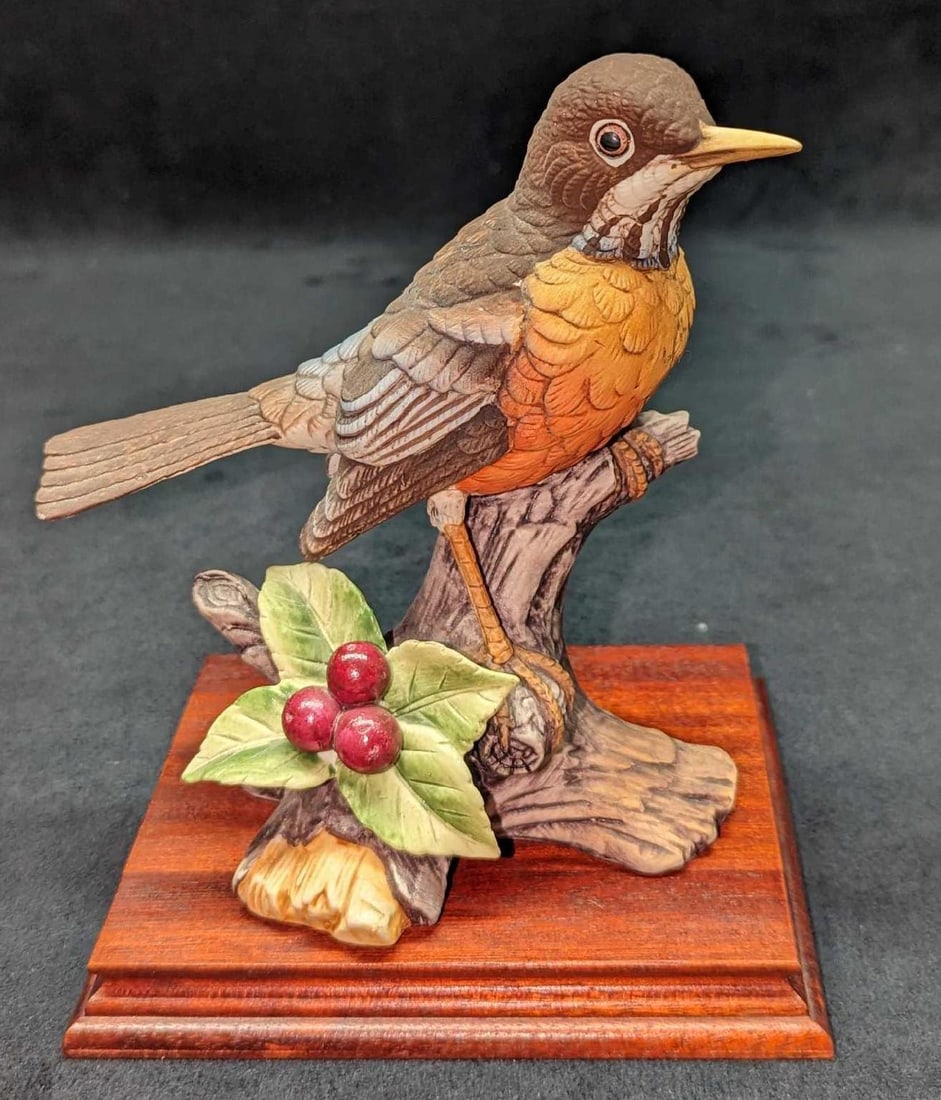Vintage Porcelain Andrea By Sadek Robin Figurine: Vintage Porcelain Andrea By Sadek Robin Figurine. This figurine is approx 5" x 6" x 6" and the display stand is approx 5 5/8" x 5" x 3/4". The total weight is 0.96lb. The display stand has some wear a