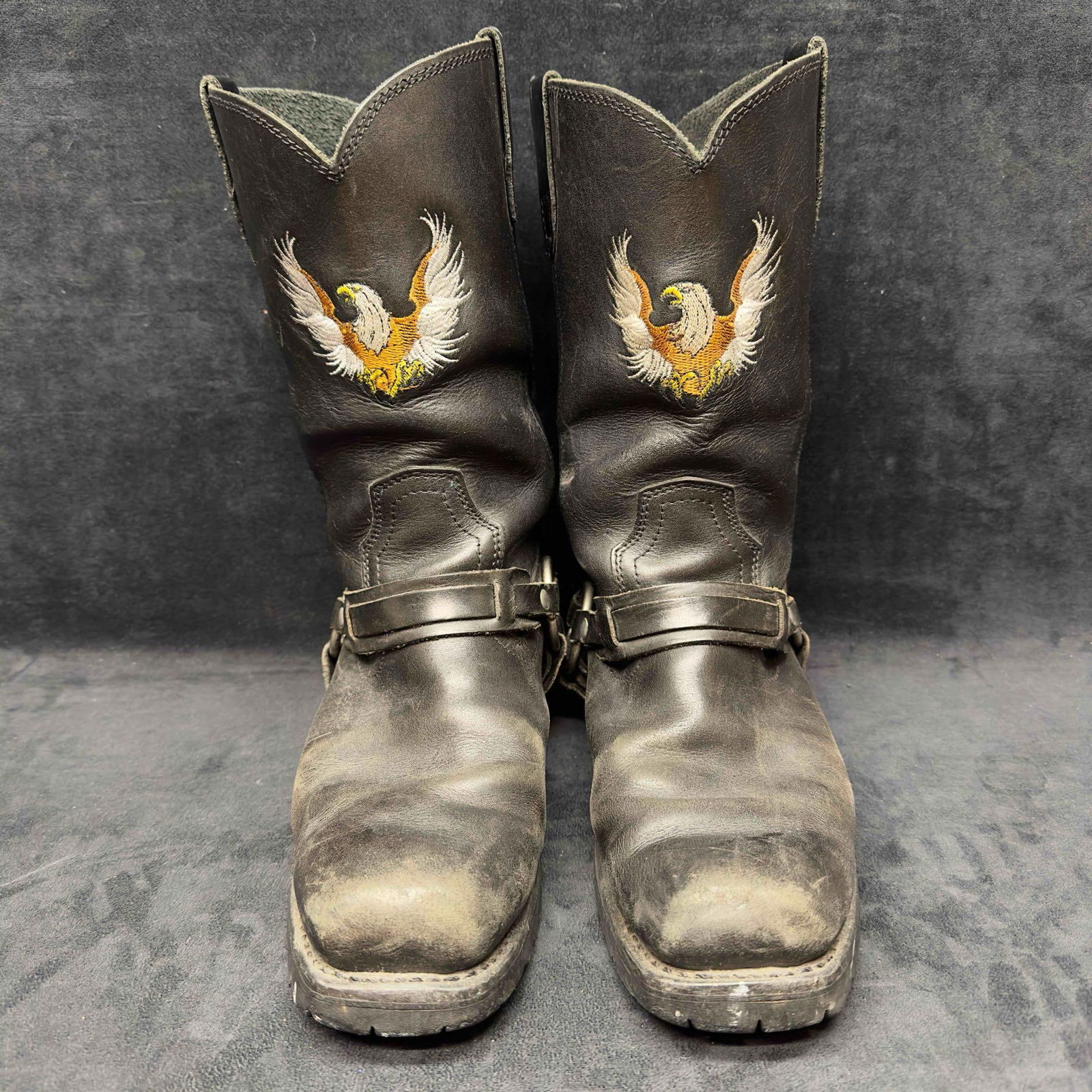 Xelement Men's Motorcycle Biker Riding Eagle Logo Black Leather Boots Size 10.5: Xelement Men's Motorcycle Biker Eagle Logo Black Leather Boots Size 10.5. Genuine leather black boots and eagle logo. Light wear noticed near front top toe area, Scuffed up, and boot sole bottoms