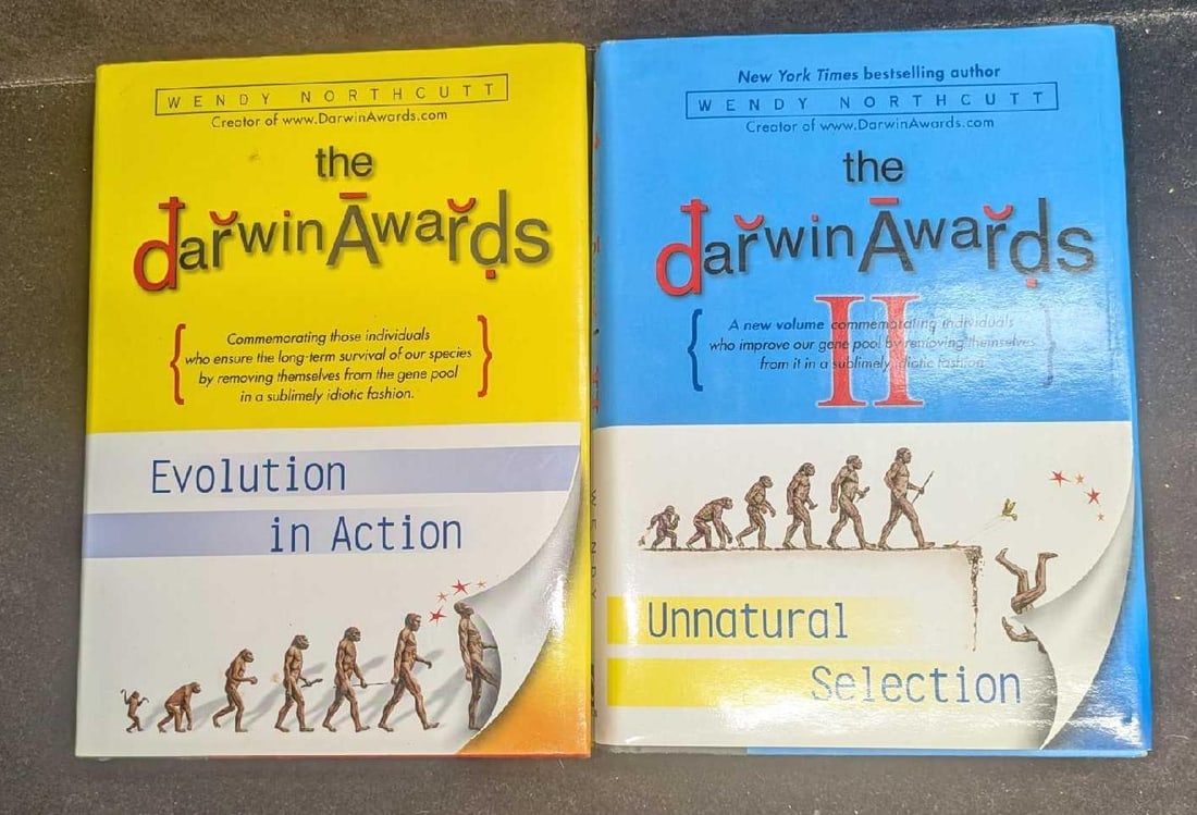 The Darwin Awards And The Darwin Awards 2 Hardcover First Editions: The Darwin Awards And The Darwin Awards 2 Hardcover First Editions. This lot includes: (1) The Darwin Awards Evolution In Action By Wendy Northcutt. This was published by Dutton in the year 2000. Firs
