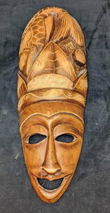Haitian Lady Wooden Wall Art Mask: Haitian Lady Wooden Wall Art Mask. This is approx 6 1/2" x 2 1/2" x 18" and it weighs 1.34lb. The mask has some light signs of wear.&nbsp;