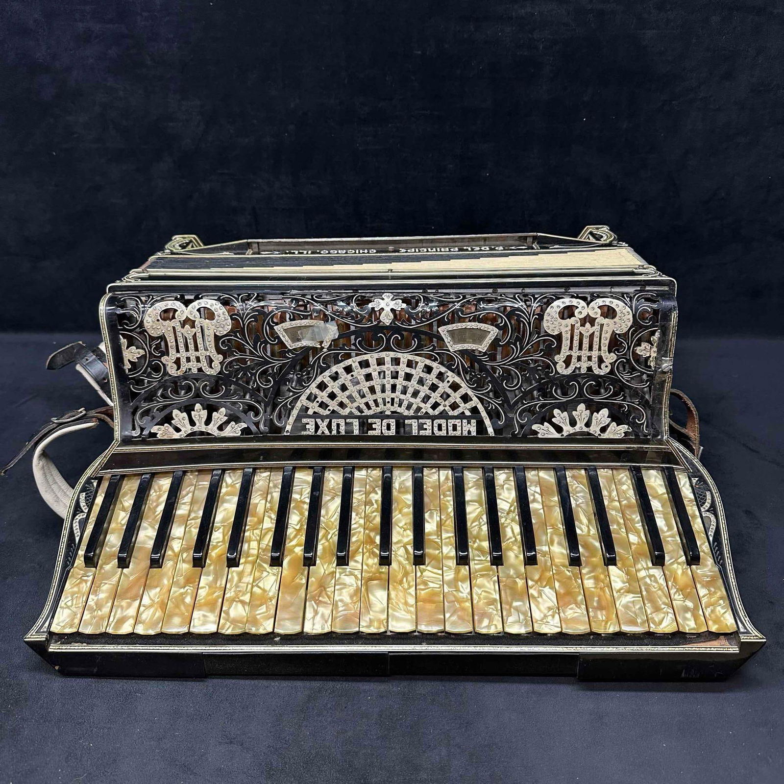 Morenschi Piano Accordion Model de Luxe with Case Broken: Morenschi Piano Accordion Model de Luxe with Case Broken. Being sold as is In Need of Repair, has not been tested, showing heavy wear with duct tape, broken loose pieces, and the case is worn. This it