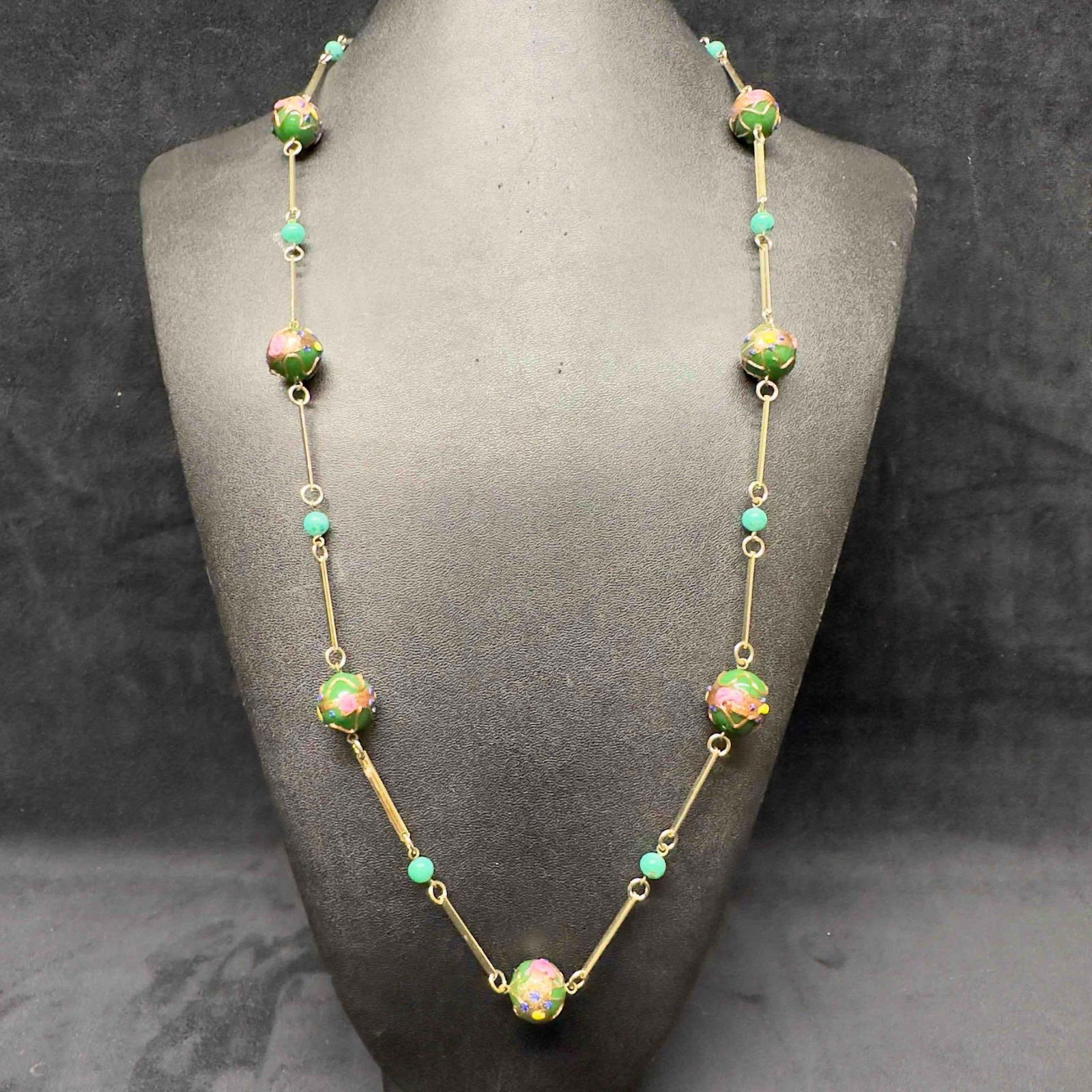 Murano Venetian Art Glass Lamp Work Green Beaded Fiorato Bead Necklace C23: Murano Venetian Art Glass Lamp Work Green Beaded Fiorato Bead Necklace C23. Necklace with green glass beads with beautiful designs on each. The necklace features floral accents. The necklace features