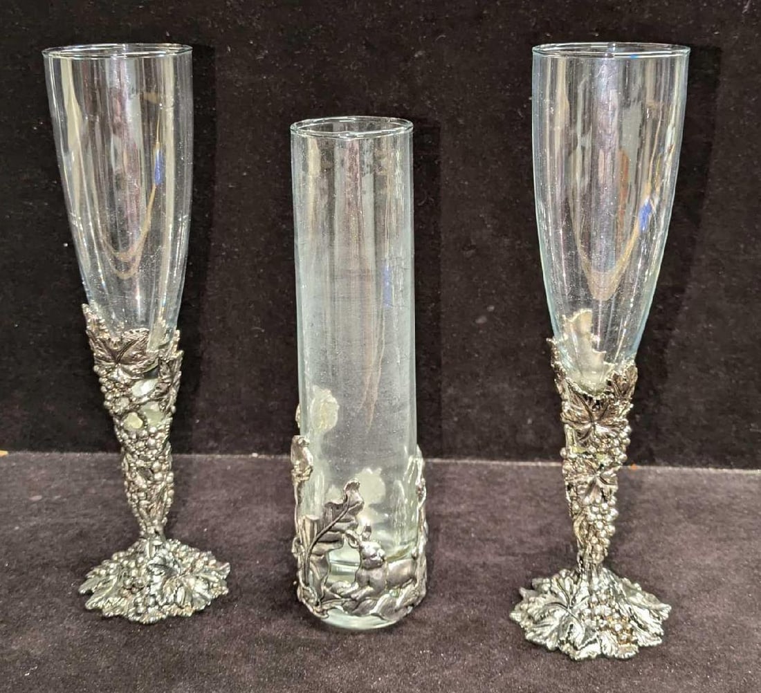 Arthur Court Wine Glasses And Bud Vase: Arthur Court Wine Glasses And Bud Vase. This lot includes: (1) Pewter And Glass Bud Vase With Calla Lilies And Rabbits. This is approx 2" x 2" x 7 1/2" (2) Grape Cluster Leaf Stemmed Win