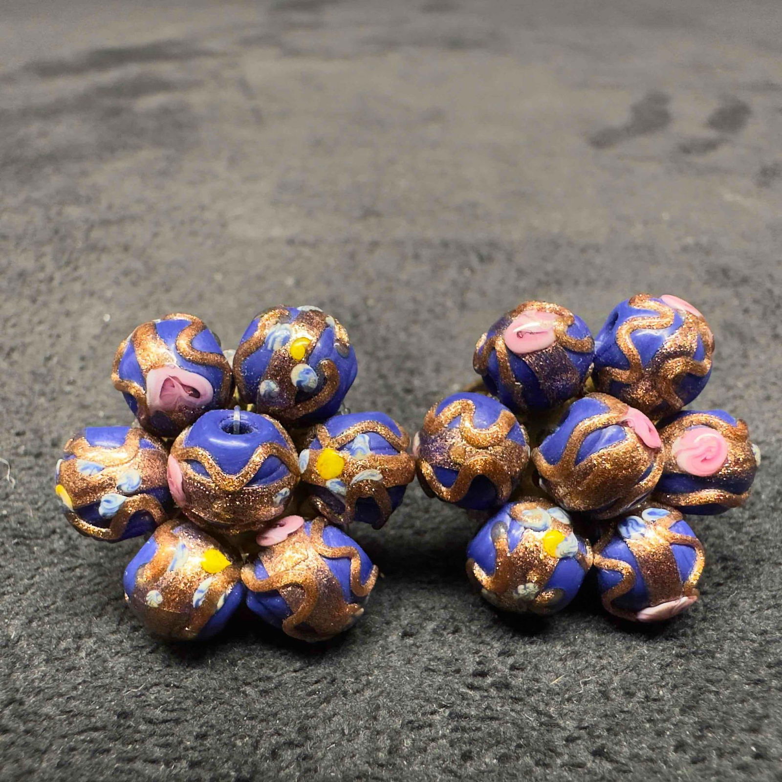 Murano Venetian Art Glass Lamp Work Dark Blue Flower Floral Round Beaded Earrings F33: Murano Venetian Art Glass Lamp Work Dark Blue Flower Floral Round Beaded Earrings F33. Earrings with dark blue glass beads with beautiful designs on each. The earrings feature pink floral and copper c
