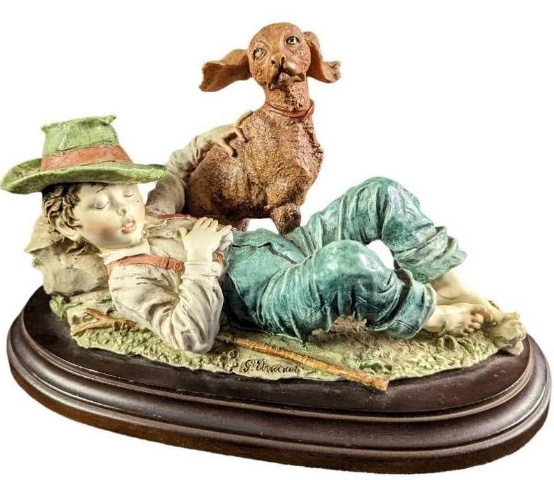 JB Giuseppe Armani Napping Boy & Dog Figurine: Here is a Giuseppe Armani Capodimonte Porcelain figurine of a napping boy with his trusty dog at his side. The figurine is approx 8" x 7" x 18" and it weighs 6.78lbs. The figurine is in a good, v