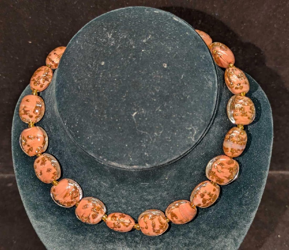 Vintage Italian Murano Art Glass Bead Necklace E: Vintage Italian Murano Art Glass Bead Necklace E. . Has a barrel clasp closure. Is approx 15" and it weighs 0.18lb. Clear glass beads have a pink and gold color inside. 