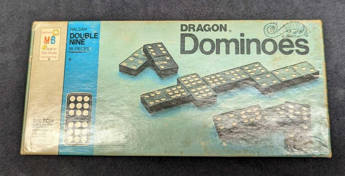 Vintage Milton Bradley Wooden Dragon Dominoes: Vintage Milton Bradley Wooden Dragon Dominoes. From 1970. Comes with all 55 pieces and its original box which is approx 8 5/8" x 3 3/4" x 1 1/4" and it weighs 0.84lb. The box has some shelf wear and t