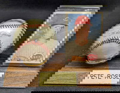 Autographed Pete Rose Baseball With Stand & Card: Autographed Pete Rose Baseball With Stand & Card.Comes with a COA from The Score Board, Inc. The card is by Topps and was part of the "Official Pete Rose Baseball Card Set". #26. This is approx 7" x 3