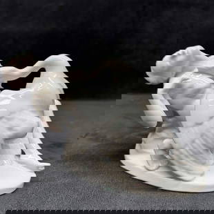 Herend Hungary Porcelain Figurine Leda with Swan White Ceramic Figure R152: A finely crafted porcelain figurine depicting the classical myth of Leda and the Swan. This piece showcases exquisite detailing and a smooth, glossy finish, capturing the grace and elegance of the sce