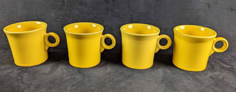 4 Yellow Sunflower HLC Fiesta Mugs: 4 Yellow Sunflower HLC Fiesta Mugs. Each is approx 5" x 2 1/2" x 3 1/2" and together they weigh 3.70lbs.&nbsp; The mugs are in a good, used condition with some signs of wear and scratches.