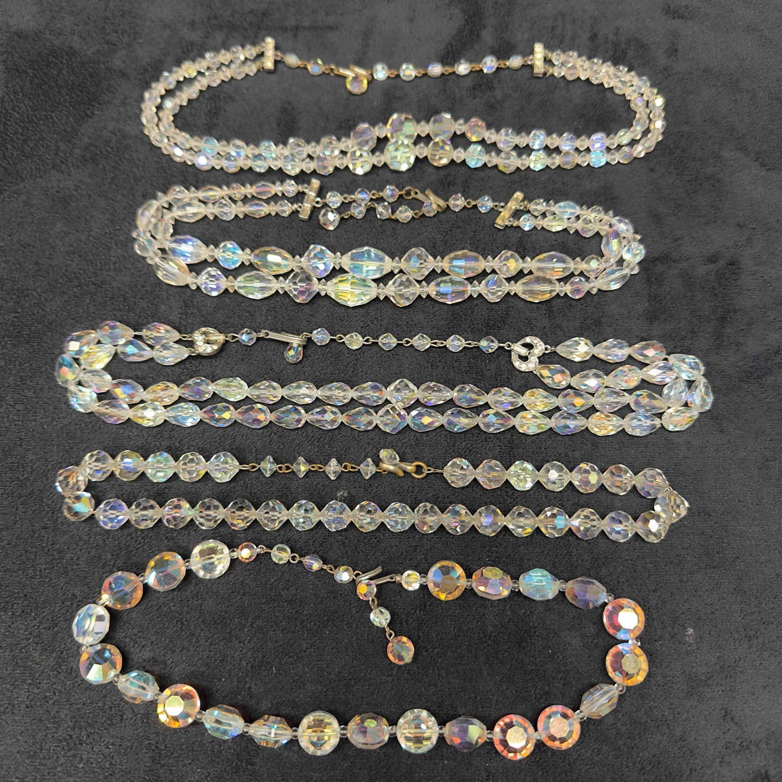 Costume Jewelry Clear Glass Crystal Single and Double Strand Necklace Set Lot of Five H65: Costume Jewelry Clear Glass Crystal Single and Double Strand Necklace Set Lot of Five H65. Necklaces with clear crystal glass beads with beautiful designs. Each necklace features a j hook clasp closur