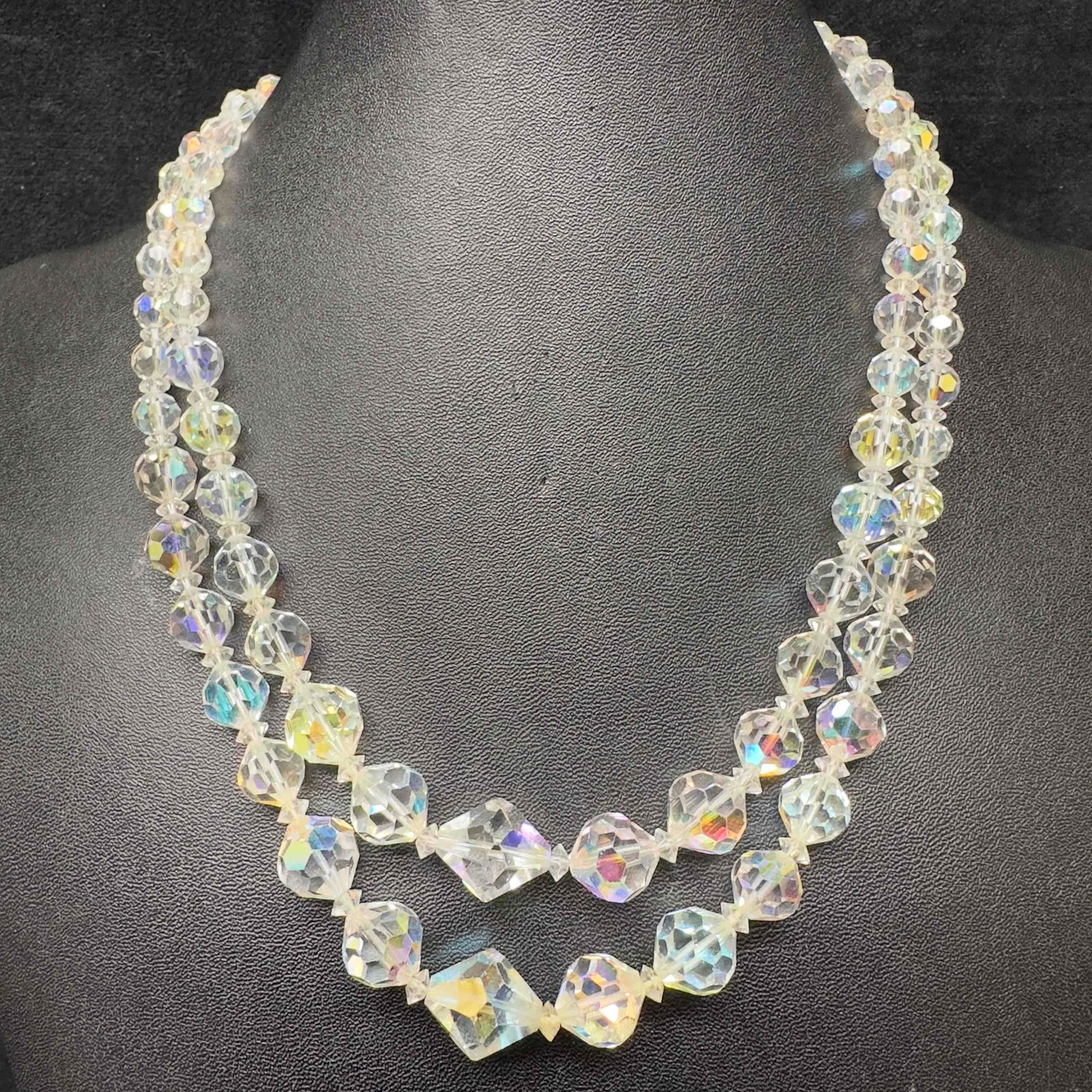 Clear Crystal Glass Iridescent Beaded Rhinestone Clasp Accent Vendome Double Strand Necklace H63: Clear Crystal Glass Iridescent Beaded Rhinestone Clasp Accent Vendome Double Strand Necklace H63. Necklace with clear glass beads with beautiful designs. The necklace features a buckle clasp closure w