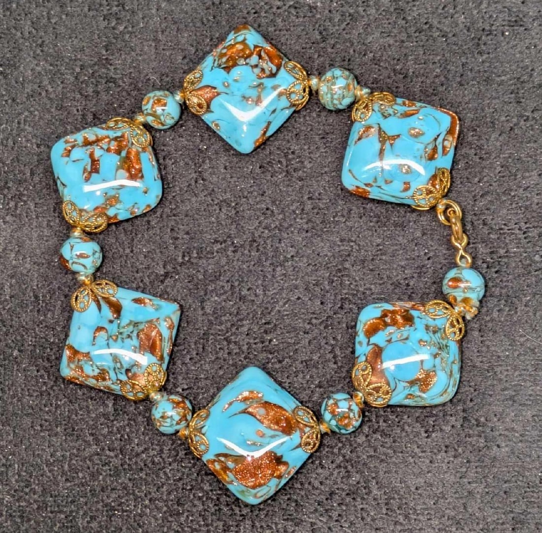 Murano Venetian Lamp Work Glass Bead Bracelet XXXXXX: Murano Venetian Lamp Work Glass Bead Bracelet XXXXXX. Blue and gold square glass with a brass clasp. This is approx 8" and it weighs 0.06lb. 