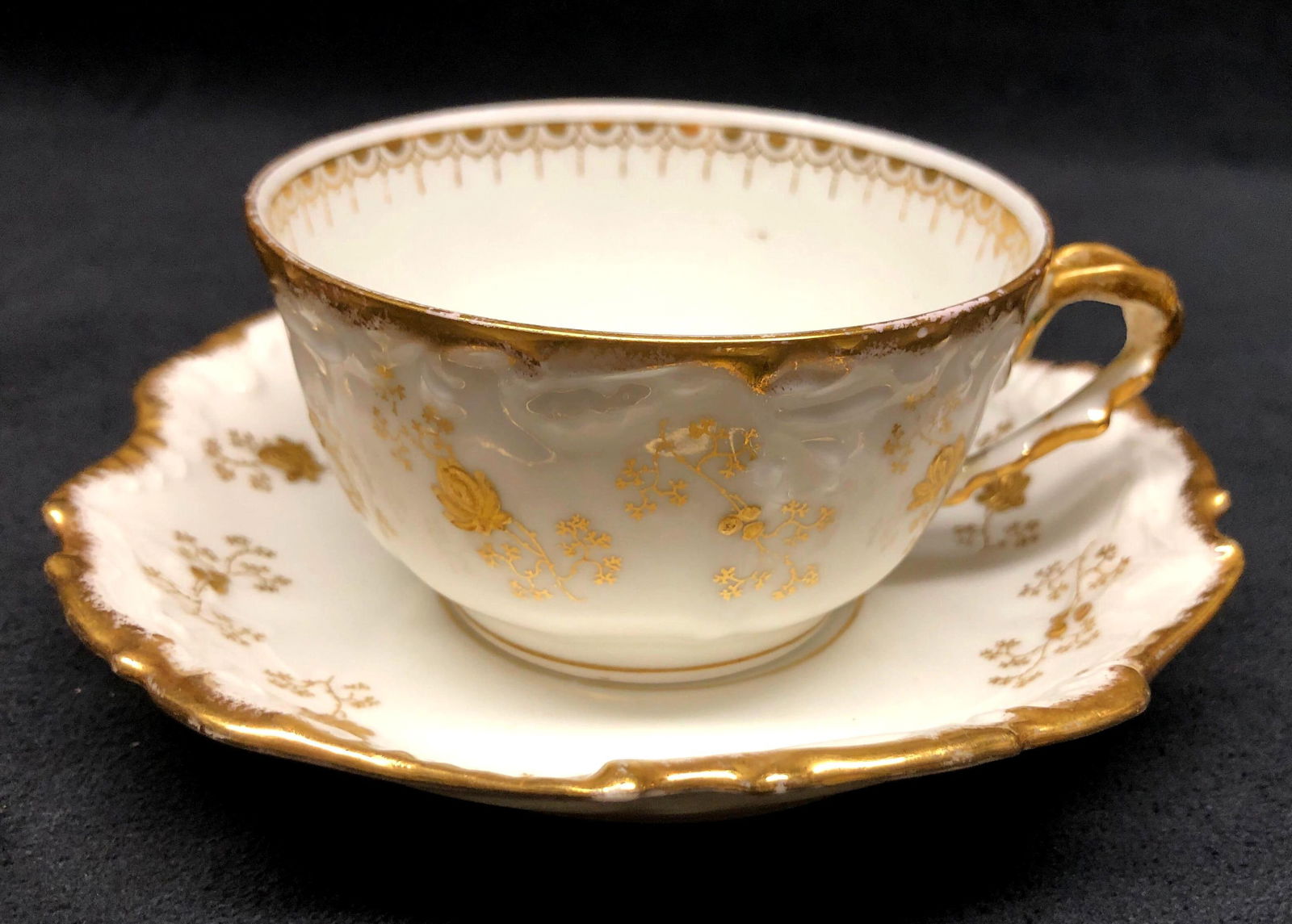 Fine China Tea Cup w Handle & Saucer - Elite Works - Higgins & Seiter - France - Gold Floral Accents: Fine China Tea Cup with Handle and Saucer - Elite Works Limoges France, Higgins & Seiter New York - Made in France - White with Gold Floral Accents. Tea Cup 4-1/4" x 3-1/2" x 2" Sauce