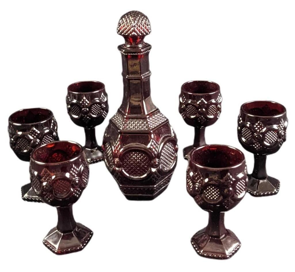Vintage Avon Cape Cod Ruby Glass Goblets & Decanter: Vintage Avon Cape Cod Ruby Glass Goblets & Decanter. This design was released from 1975 to 1992 by Avon. This lot includes: (6) Wine Goblets. These are approx 2 1/4" x 2 1/4" x 4 1/2"