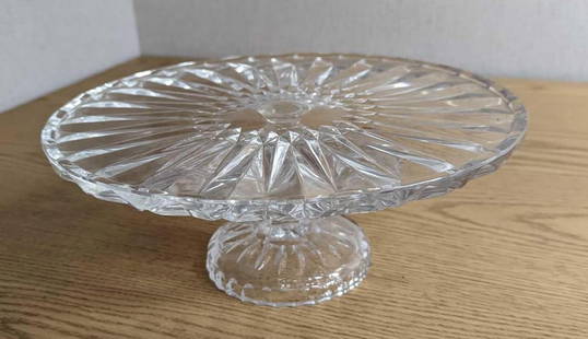 Vintage Crystal Footed Cake Plate: Vintage Crystal Footed Cake Plate. Maker and date of creation is unknown. The cake plate is approx 11 3/4" x 11 3/4" x 4 5/8" and it weighs 4.76lbs. The cake plate is in a good, vintage condition with