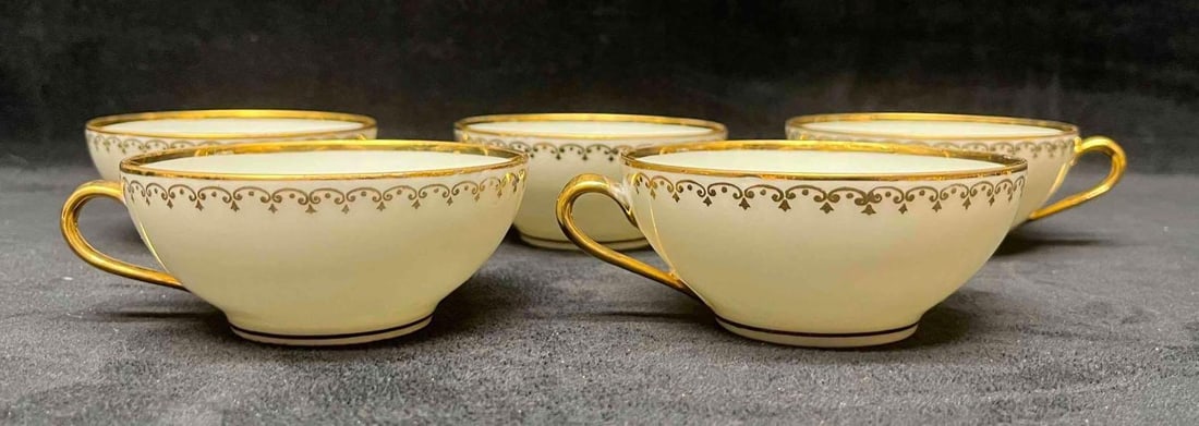 Five Limoges Gold Trim Tea Cups: This lot contains a Five Limoges Gold Trim Tea Cups. Each Tea cup is approx 4 1/4" x 3 3/4" x 1 3/4". Total weight is 0.7lbs. Overall the Limoges Tea Cups are in good used condition with no chips or c