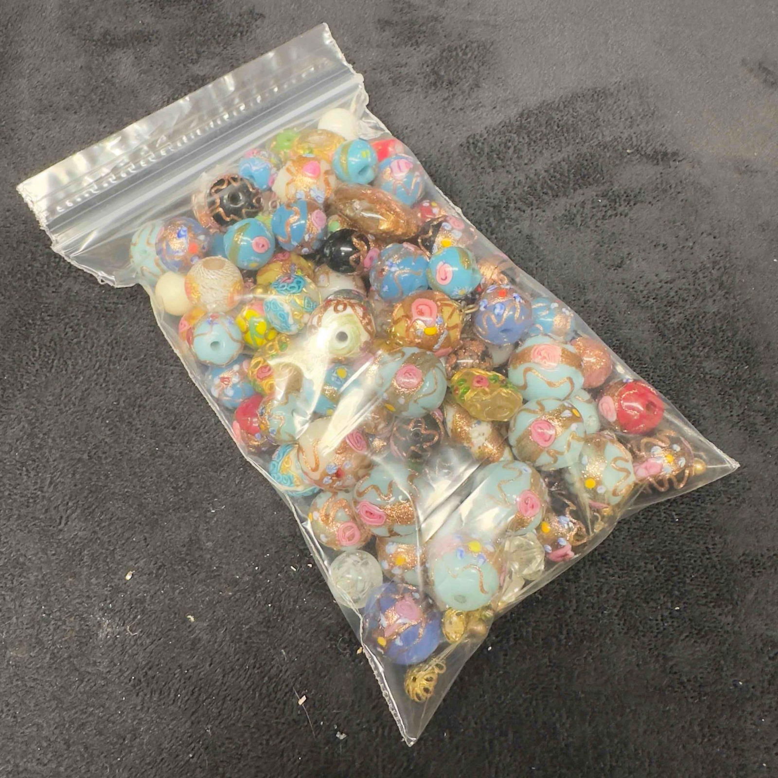 Venetian Murano Lamp Work Art Glass Beads Collection Jewelry Beaded Piece Set Lot of 100 Pieces G26: Venetian Murano Lamp Work Art Glass Beads Collection Jewelry Beaded Piece Set Lot of 100 Pieces G26. Over 100 multi colored glass beads with beautiful hand painted designs on each. The beads feature v