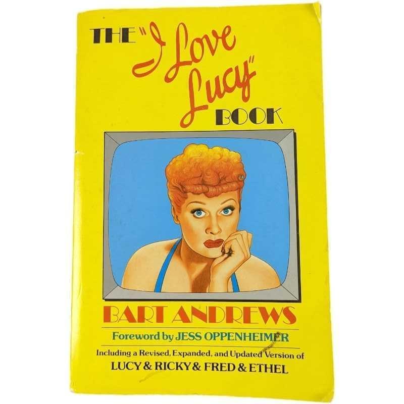 The I Love Lucy Softcover Book Lucille Ball: "The I Love Lucy Book" by Bart Andrews. Published by Doubleday (New York). The book is approx 6" x 1" x 9" and it weighs 1.22lb. The book is in good, used condition with some shelf