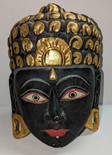 Southeast Asian Vintage Carved Buddhist Priest Wall Art: Southeast Asian Vintage Carved Buddhist Priest Wall Art. Hand-painted wooden wall art mask that was likely Thai or Burmese in origin. This is approximately 7" x 3" x 10 1/4" and it weighs 0.85lb. Ther