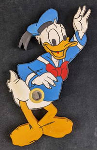 Hand Made Wooden Waving Donald Duck Sign: Hand Made Wooden Waving Donald Duck. Has a button that no longer does anything. Could have been a door bell, or it could have made sounds at one time, now it's just a wooden Donald Duck with a button.