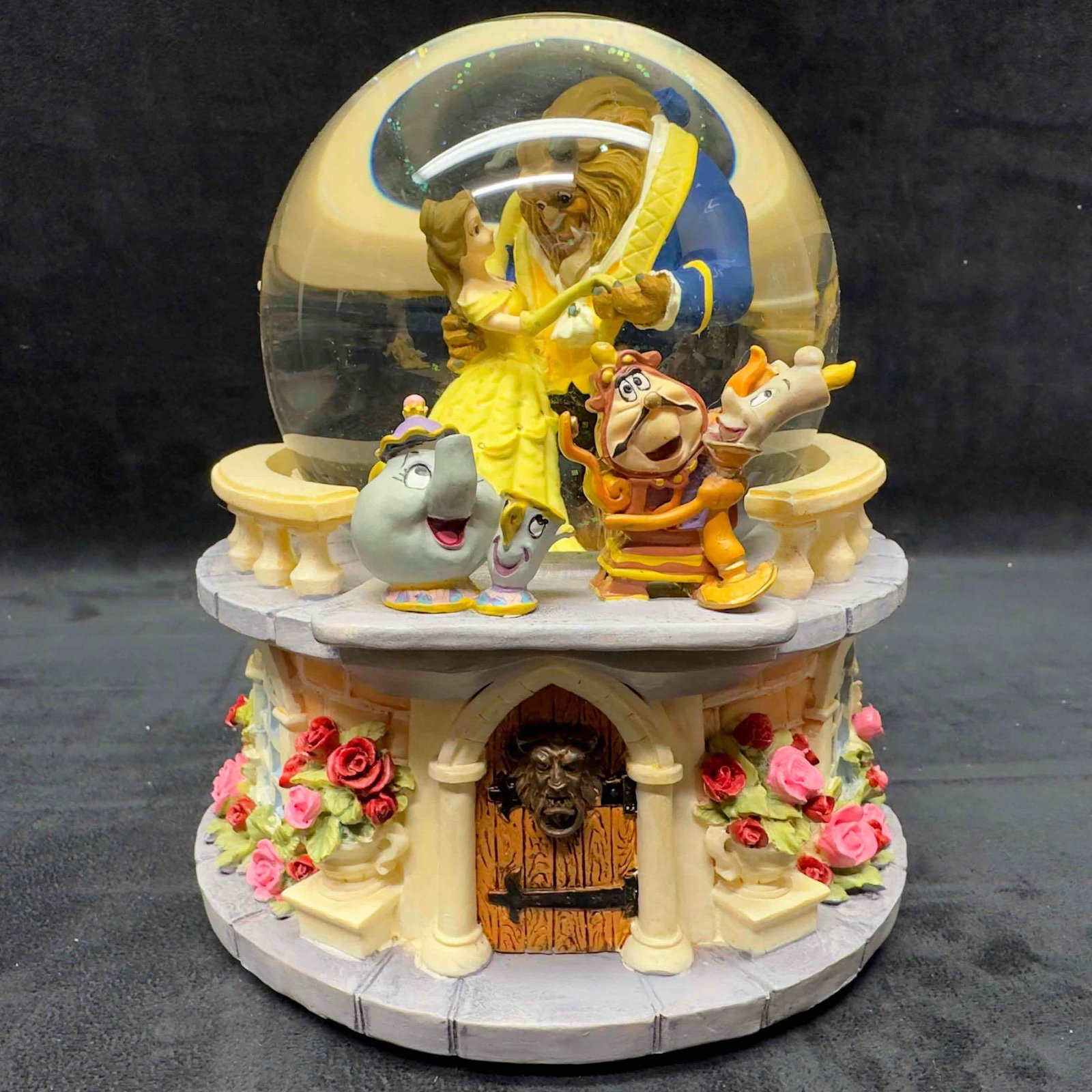 Beauty and the Beast Ballroom Rose Garden Disney Musical Snow Globe: Beauty and the Beast Ballroom Rose Garden Disney Musical Snow Globe. This Disney musical snow globe features Belle and the Beast sharing a dance while Mrs. Potts, Chip, Lumiere, and Cogsworth look on