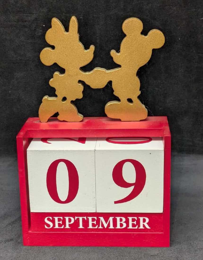 Disney Mickey Mouse Wood Block Calendar: Disney Mickey Mouse Wood Block Calendar. By Kcare. This is approx 5 3/4" x 2 5/8" x 8 3/8" and it weighs 1.30lb. There are some markings and Minnie is slightly loose, but still attached.