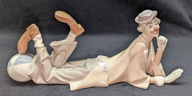 Lladro Porcelain Clown With Beach Ball Figurine: Lladro Porcelain Clown With Beach Ball Figurine. This was designed by Salvador Furio and was originally released in 1970. This is approx 15" x 5" x 6" and it weighs 2.63lb. The figurine