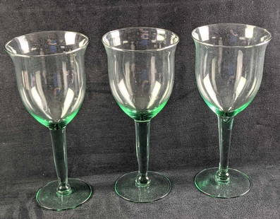Three Large Glass Water Goblets: Three Large Glass Water Goblets. All have a hint of green/teal color in the glass, mostly in the steams. The glasses are approx 4 1/8"x&nbsp; 4 1/8" x 9 1/2" and they all weigh together 1.67lb. The ma