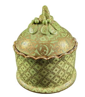Green & Gold Porcelain Round Trinket Box: Hand-Painted Green & Gold Porcelain Round Trinket Box. The trinket box is approx 5 5/8" x 5 5/8" x 7" and it weighs 2.85lbs. The box is in a good, used condition with no chips or cracks. Has a light c