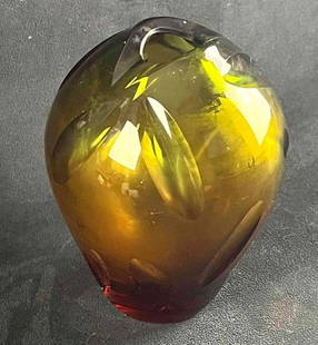 WMF Glass Art Vase by Erich Jachmann: WMF Glass Art Vase by Erich Jachmann  Pictured is a striking and heavy art vase in deep bottle green graduating to glowing amber. The vase has a narrow mouth and ovoid body optic cut with a series of