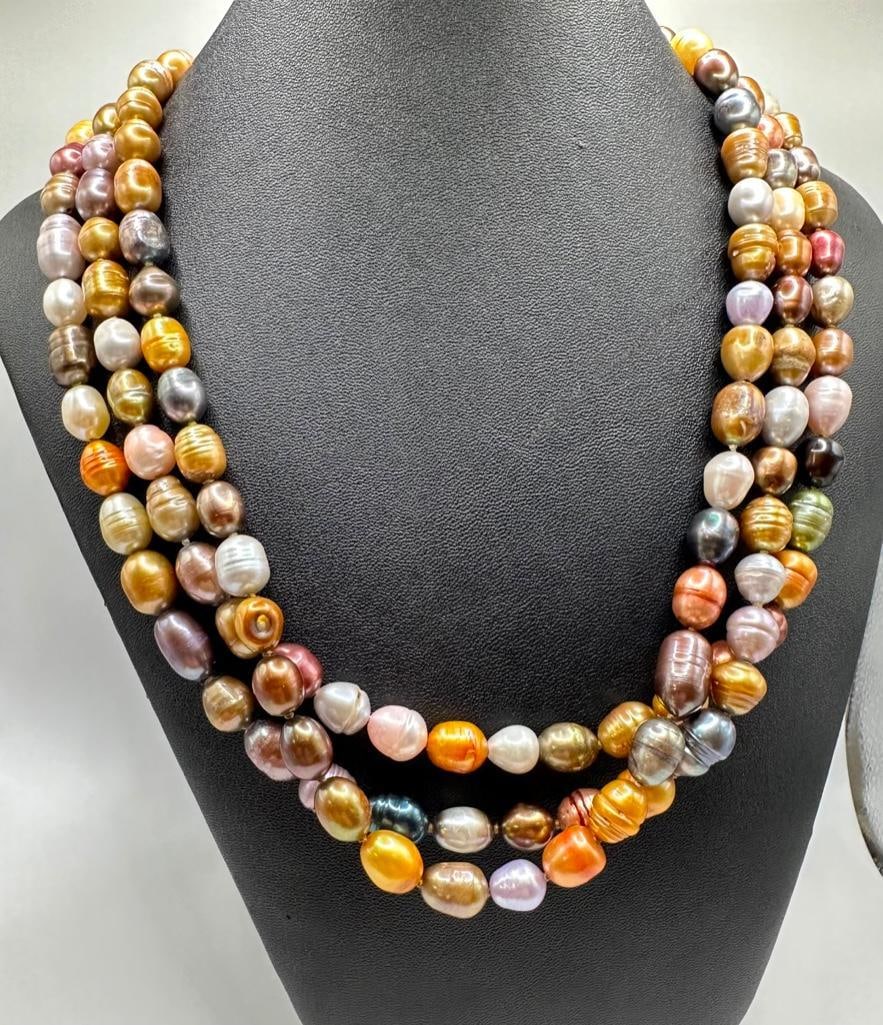 62" Multicolor River Pearl Strand Necklace: This piece of jewelry has been tested and researched prior to listing. Please view all our pictures they are part of our description. DETAILS: Metal - none Color - multi Stones - River Pearls Hallmar