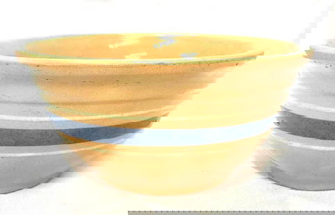 VTG Watt Yellow Ware Cold-N-Bake Mixing Bowl: Vintage Watt Pottery Yellow Ware Cold-N-Bake Mixing Bowl with Blue Band. It is approx 3-1/2" x 7-1/4" x 7-1/4" and it weighs 1.2lbs. The Yellow Ware Mixing Bowl is in a used, vintage condition with so