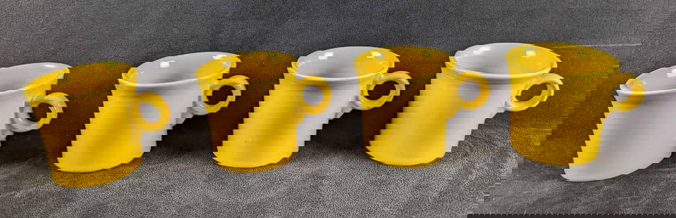 4 Yellow Sunflower HLC Fiesta Mugs: 4 Yellow Sunflower HLC Fiesta Mugs. Each is approx 5" x 2 1/2" x 3 1/2" and together they weigh 3.49lbs. The mugs are in good,used condition with some signs of wear and scratches inside the mugs and o