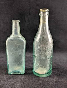 Antique Glass Drink Bottles: Antique Glass Drink Bottles This lot has two glass drinking bottles with the bottling companies name or trademark on them. These bottles are all in good condition with no cracks or chips, these may be
