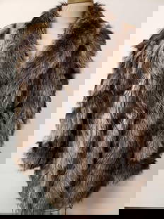 Mid Length Raccoon Fur Coat: Mid Length Raccoon Fur Coat. This raccoon fur coat is in great used condition. The coat has no known signs of damage to the interior or exterior. The inside of the coat is lined with a silver patterne