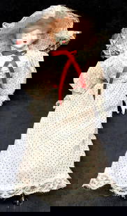 Vintage "The Gibson Girl" Porcelain Doll 16": Vintage "The Gibson Girl" Porcelain Doll wearing a White & Red Polka Dot Dress with Lace Trim, and Matching Hat. It is approx 16" x 4" x 2-1/2" and it weighs 0.5lbs. The Porcelain Doll is in a used, v