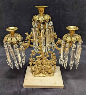 Vintage Gilt Brass Candelabra With Crystal Prisms (F37): Vintage Gilt Brass Candelabra With Crystal Prisms (F37). Is approx 15" x 5 1/2" x 15 1/2" and it weighs 9.20lbs. The Candelabra shows a woman and a small girl standing by a tree.&nbsp;It is made of gi