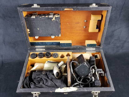 Vintage Carl Zeiss Microscope Box and Contents: Vintage Carl Zeiss Microscope Box and Contents. This microscope kit is in fair used condition. The kit appears to be quite old, probably from the 50s, and as such has a good amount of wear. The micros