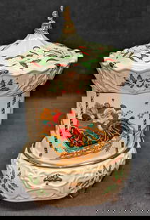 Holiday By Lenox China Miniature Carousel Music Box: Holiday By Lenox China Miniature Carousel Music Box. Plays "Wish You A Merry Christmas". Green holly & red ribbon on a cream background with gold trims. Is approx 6" x 6" x 8 1/2". It comes in it